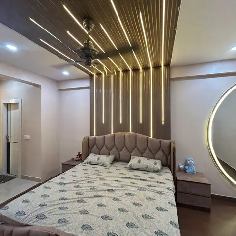 Bedroom where fluted brown panelling climbs the headboard wall and folds across the ceiling