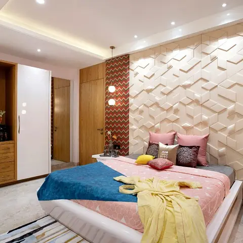 Bedroom with a 3D faceted panel headboard wall flanked by chevron-print wallpaper strips and twin globe pendant lights.