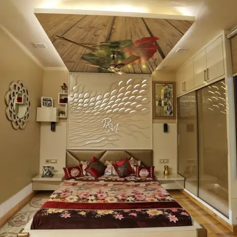 Bedroom with a 3D wave-textured monogrammed headboard wall panel, a printed wood-and-leaf ceiling mural and a sliding wardrobe with a frosted bird-print glass