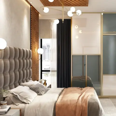 Bedroom with a channel-tufted grey upholstered headboard against a diamond-pattern fluted wood panel wall
