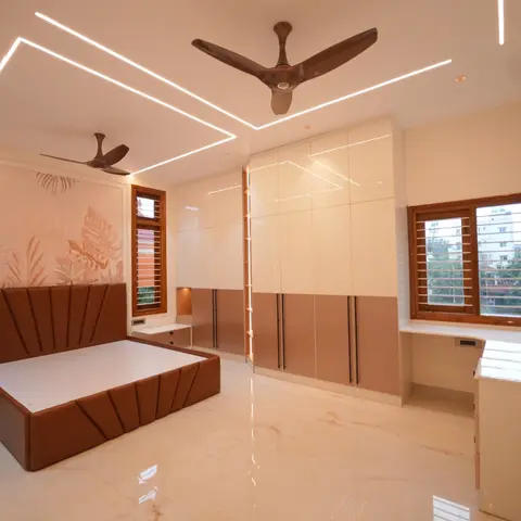 Bedroom with a channel-tufted rust leather bed against a botanical-print wallpaper panel, floor-to-ceiling glossy two-tone wardrobes