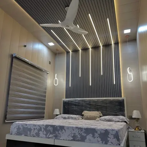 Bedroom with a continuous wood-slat wall-to-ceiling surface lit by cascading vertical LED strips