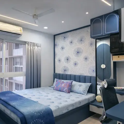 Bedroom with a dandelion-pattern wallpaper accent wall, a navy channel-tufted headboard, and a built-in arched-motif wardrobe beside a study desk.