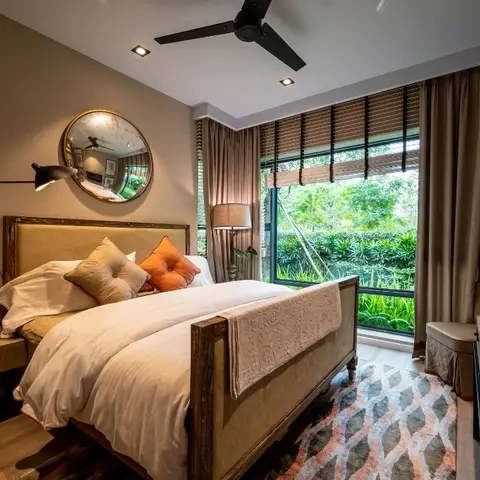Bedroom with a dark wood sleigh-style bed, a round convex mirror over an articulated wall reading light, a patterned area rug
