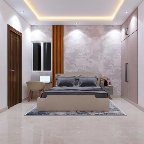Bedroom with a fluted-wood accent strip against a textured stone-look wall, cove-lit ceiling, and a built-in study nook by the window.