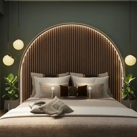 Bedroom with a fluted-wood arched headboard feature wall lit by an LED ring, flanked by potted plants and globe pendant lights
