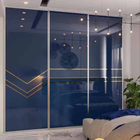 Bedroom with a full-height navy-and-gold glossy sliding wardrobe featuring chevron gold inlay