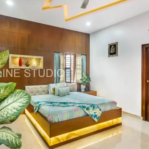 Bedroom with a full-height teak veneer headboard wall, a stone-lined lit display niche