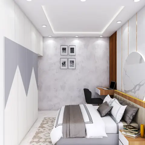Bedroom with a geometric two-tone chevron-pattern wardrobe, a marble-effect headboard wall with brass inlay strips and a circular illuminated mirror