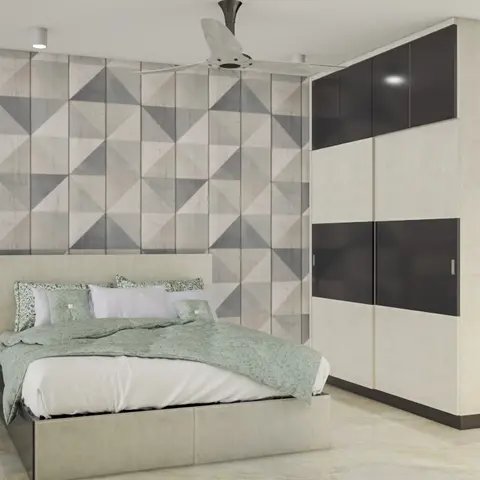 Bedroom with a grey geometric-triangle wallpaper feature wall behind an upholstered bed in sage-green bedding