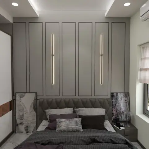 Bedroom with a grey tufted headboard set against a panelled feature wall lit by two slim vertical LED strips