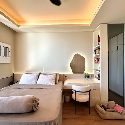 Bedroom with a mirrored sliding wardrobe, a wall-mounted study/vanity desk under a wood accent mirror