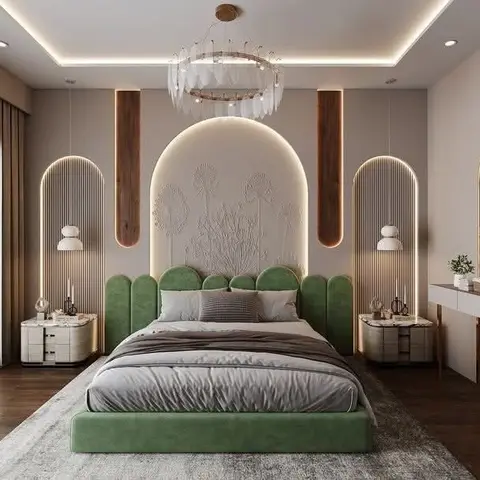 Bedroom with a sage-green scalloped upholstered bed under a sculpted floral plaster headboard panel flanked by backlit arched niches and a dressing table
