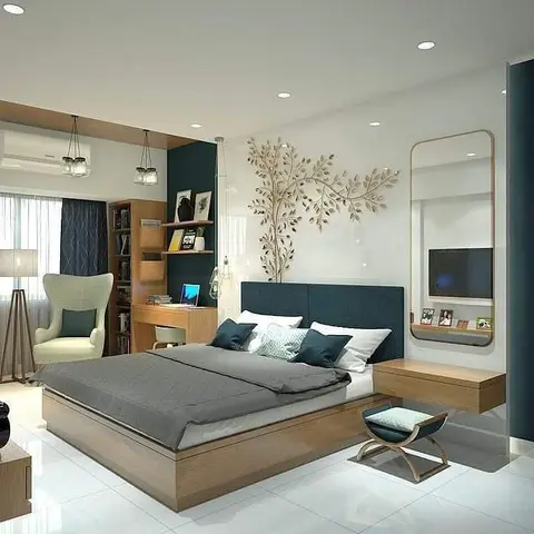Bedroom with a teal upholstered headboard, wall-mounted TV on a floating console, and a built-in study nook with pendant lighting beside the window