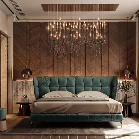Bedroom with a teal velvet channel-tufted bed against a chevron wood panelled wall, under a cascading multi-drop pendant chandelier.