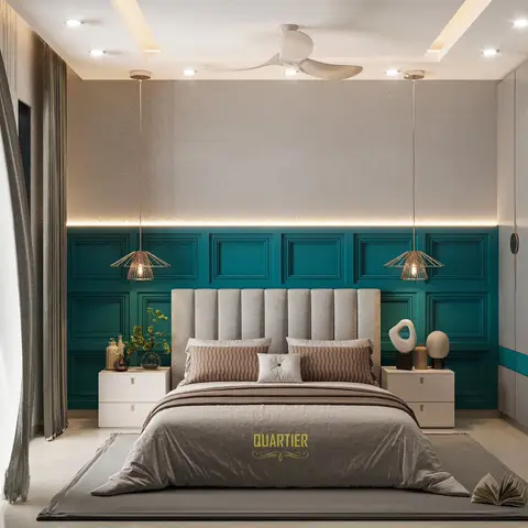 Bedroom with a teal wainscot-panelled headboard wall lit by twin brass pendant lights either side of a grey channel-tufted upholstered headboard