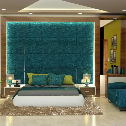 Bedroom with a tufted teal upholstered headboard wall lit from behind, and an olive-green accent wall with a gallery of framed photographs.