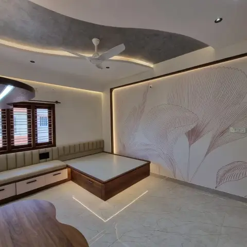 Bedroom with a wood platform bed lit by an under-base LED profile, a botanical line-art wallpaper mural and a built-in tufted window seat.