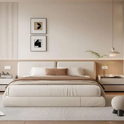 Bedroom with an upholstered king bed flanked by floating nightstands and pendant lamps, a fluted wood-slat accent wall with two framed abstract prints