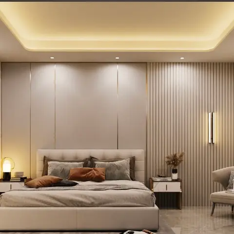 Beige bedroom where a smooth panelled headboard wall meets a taupe fluted section carrying a slim vertical light