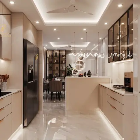 Beige handleless galley kitchen opening onto a dining bar, brass-trimmed tinted-glass uppers