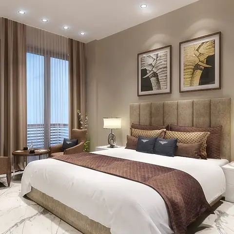 Beige master bedroom with a channel-tufted upholstered headboard, a paired-armchair sitting nook by the balcony