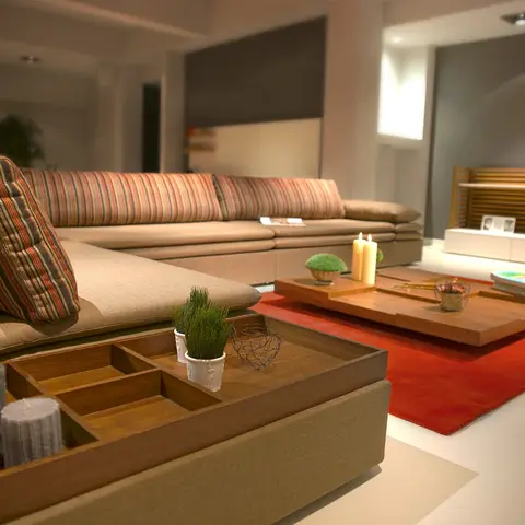 Beige sectional sofa with striped bolster cushions facing a low wood coffee table on a red rug, with a slatted wood partition and TV console in the background.