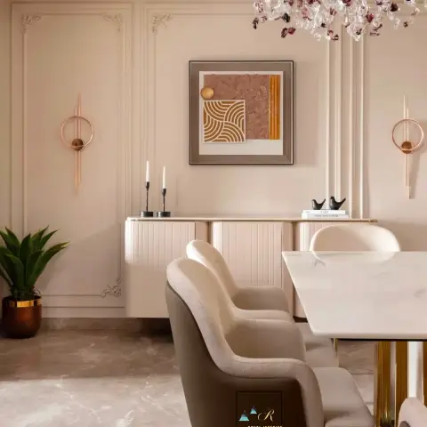 Blush dining room where a marble-top table on a brass column stands under a chandelier of plum and clear glass pebbles