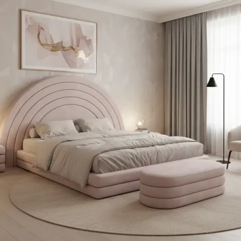 Blush-pink primary bedroom with an arched channel-tufted velvet headboard, a matching upholstered bench