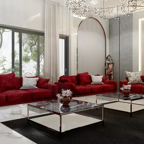 Bold living room with three red velvet sofas arranged around black marble coffee tables on a black rug, under a branching bead chandelier