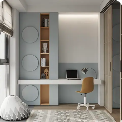 Built-in study nook with a blue-grey wardrobe wall, open wood display shelving, a backlit desk niche, and a mustard task chair.