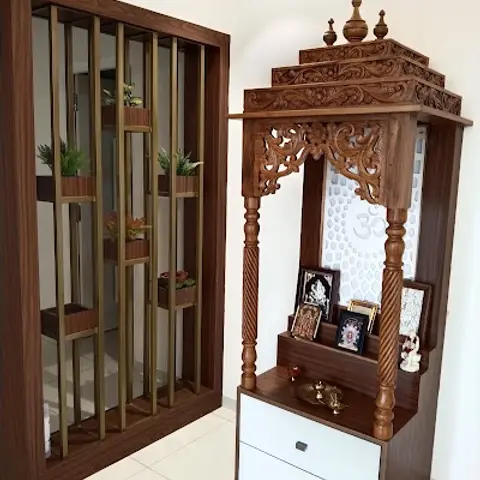 Carved wood pooja mandir with turned pillars, domed canopy and white drawer storage