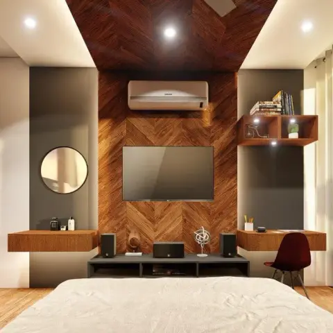 Chevron-laid wood panel that runs up the TV wall and folds onto the ceiling, flanked by a floating dresser ledge with a round black-rimmed mirror on one side