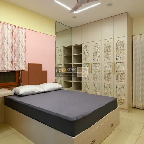 Child's bedroom with a pink accent wall and paper butterflies at the corner, a beige storage-drawer platform bed with stepped headboard