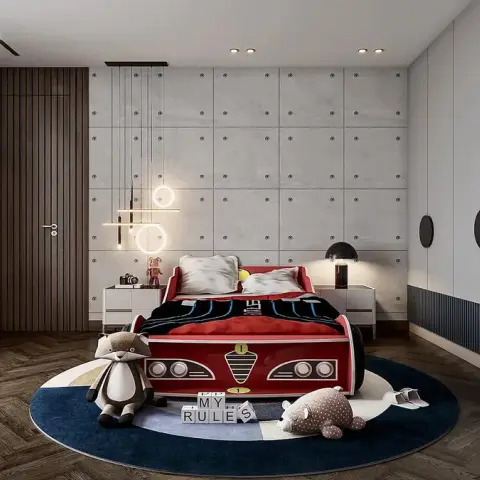 Child's room built around a red racing-car bed on a round navy-and-cream rug, with a bolted faux-concrete panel wall behind