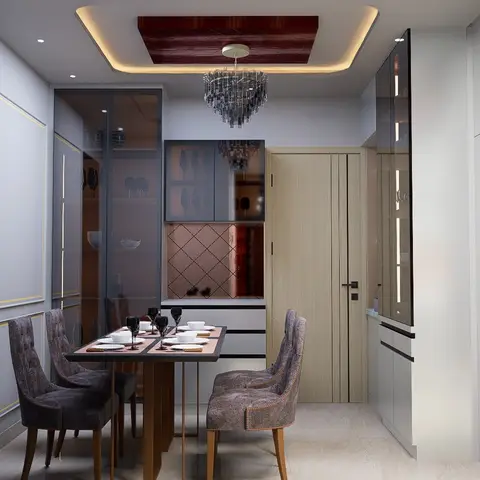 Compact dining nook with grey nailhead-trim tufted chairs around a marble-top table set for four