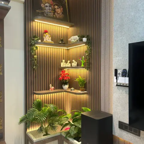 Corner display unit in vertical wooden slat fluting with three backlit L-shaped shelves of idols