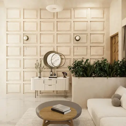 Cream living room where a full-height grid of square plaster mouldings backs a fluted ivory console with two overlapping round marble-faced mirrors