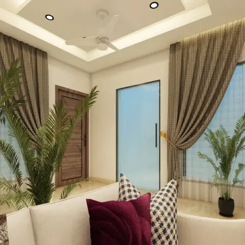 Cream sofas with maroon and ikat cushions in a corner framed by tall tie-back curtains