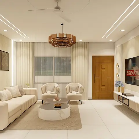 Cream tufted sofa with two curved accent armchairs around a round marble coffee table