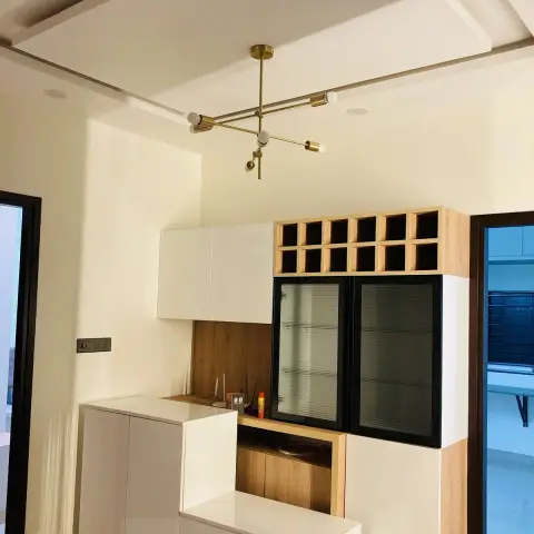 Crockery and bar unit in white gloss with black-framed fluted-glass display doors, a grid of oak wine cubbies above it