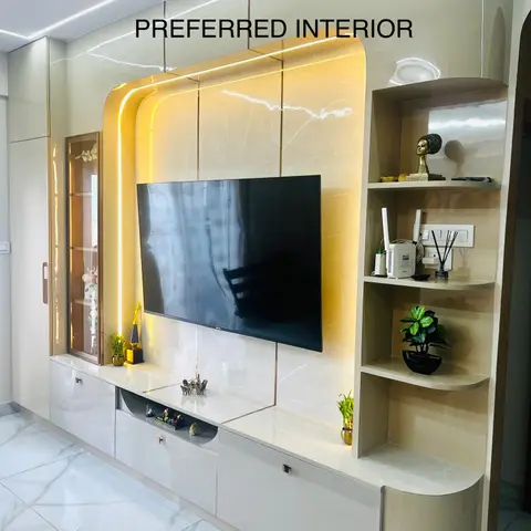 Curved backlit marble-look TV feature wall with gold trim lighting, a glossy cream console below