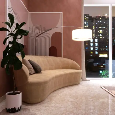 Curved camel sofa against a terracotta textured wall with an arch line-art panel, an arc lamp reaching over it and a lit city skyline through full-height