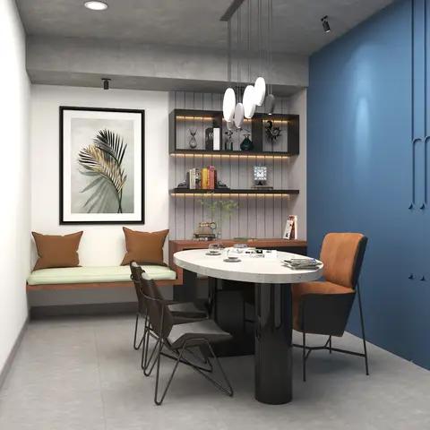Dining nook with a built-in bench seat, terrazzo-top round table and mixed leather chairs against a blue fluted-panelled wall