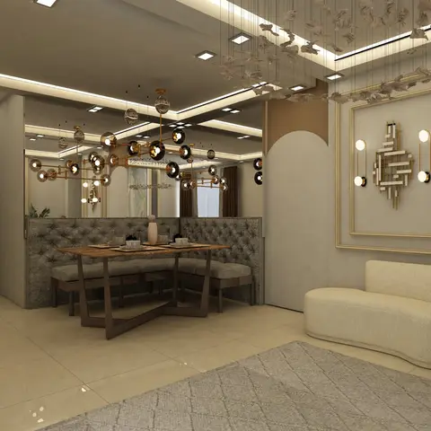 Dining nook with a tufted grey bench-seating table beneath a sculptural brass-and-glass pendant cluster