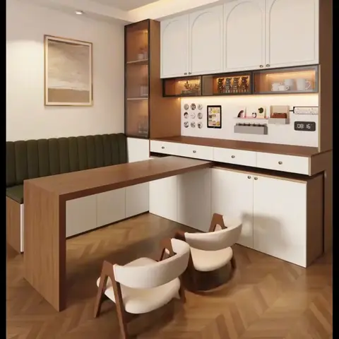 Dining nook with an olive channel-tufted bench, a wood table, arched white overhead cabinets with glass display shelving, and a herringbone parquet floor.