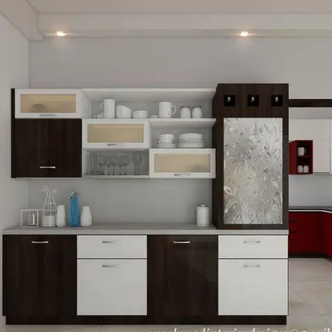 Dining room crockery unit with glass-shuttered display shelves for dishware, walnut and white cabinetry, glimpsing a red modular kitchen beyond.