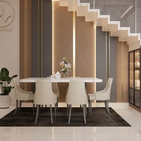 Dining room with a six-seat cream upholstered dining set on a dark rug, backed by a wood-slat gold-trimmed feature wall beneath an open staircase
