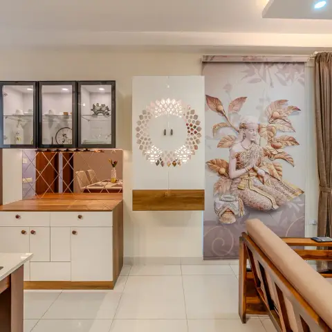 Dining-side crockery unit with black-framed glass wall cabinets over a rose-gold diamond mirror backsplash