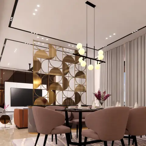 Dining table with blush pink upholstered chairs beneath a spherical globe pendant chandelier